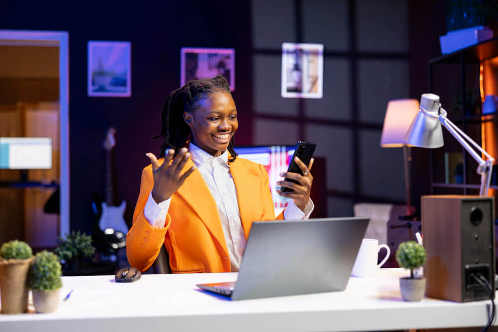 digital marketing for beginners in 2025 - A happy lady in a well-litt podcast room