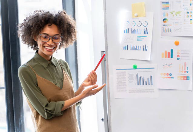 digital marketing for beginners in 2025 - A lady reading through whats written on a whiteboard