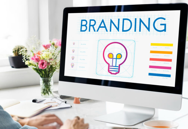 Digital marketer analyzing social media profiles for personal brand consistency