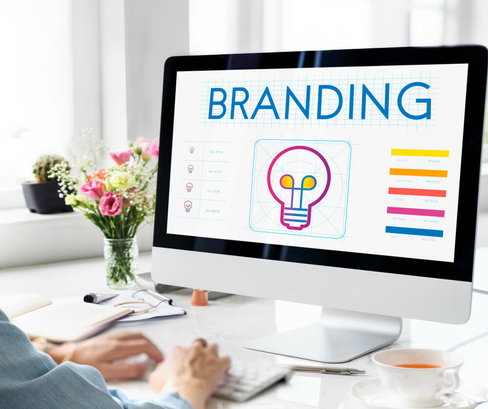 Digital marketer analyzing social media profiles for personal brand consistency